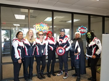Nursing team at BioPlus each dressed in superhero costumes.
