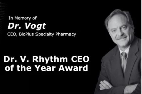 Photo of Dr. Vogt and the new award: Dr. V. Rhythm CEO of the Year Award